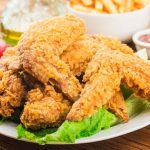 fried-chicken-wings-wooden-table_1205-7734